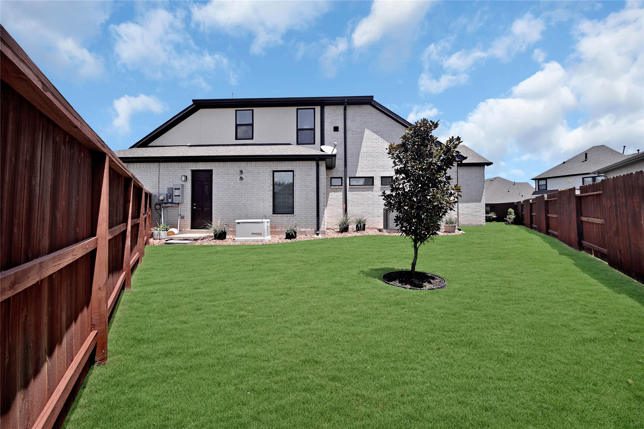 A spacious side yard provides extra outdoor flexibility, and you'll also notice the 24kW generatoroffering added peace of mind when you need it most!