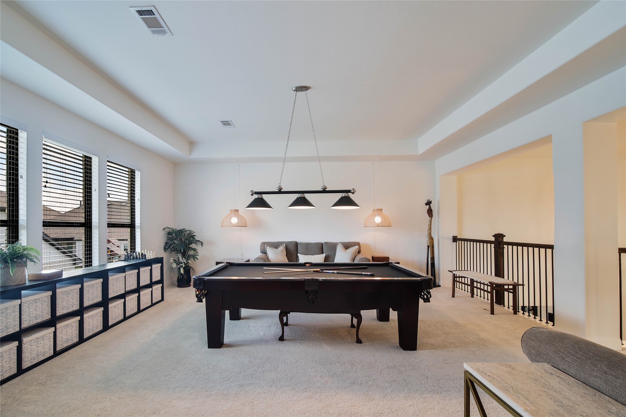 The billiard-size game room offers plenty of space for a pool table, games, and gathering with family and friends.