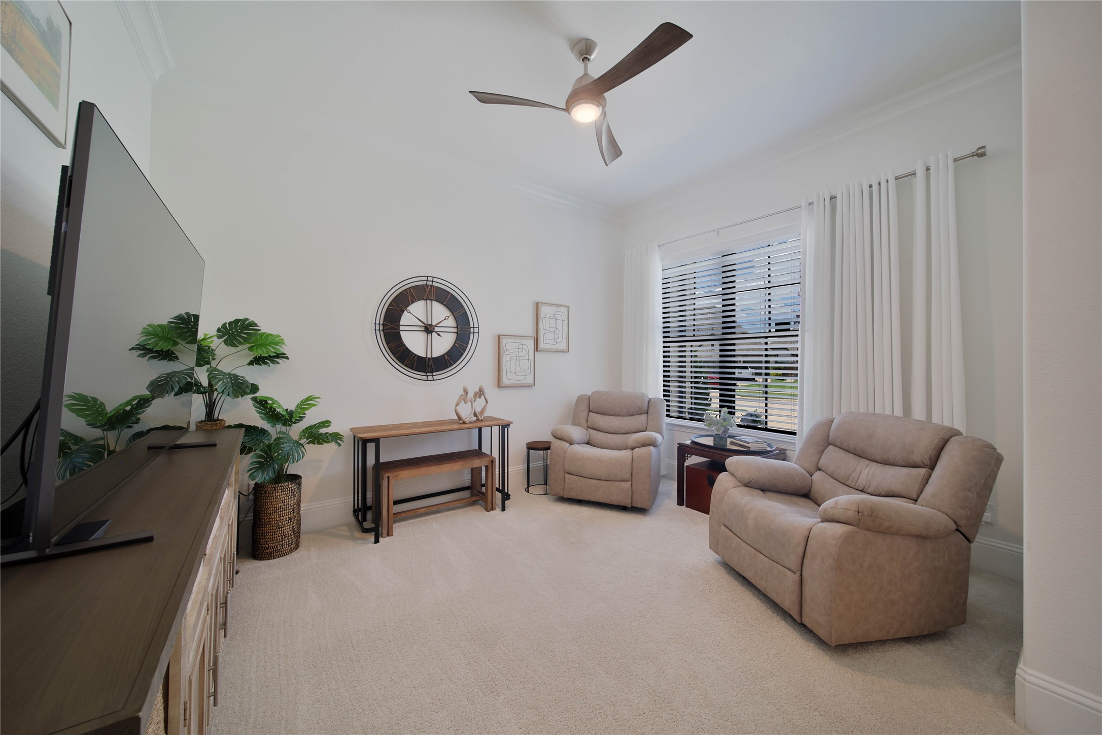 The flexible front room offers endless possibilities, perfect for use as a private study, home office, or comfortable den.