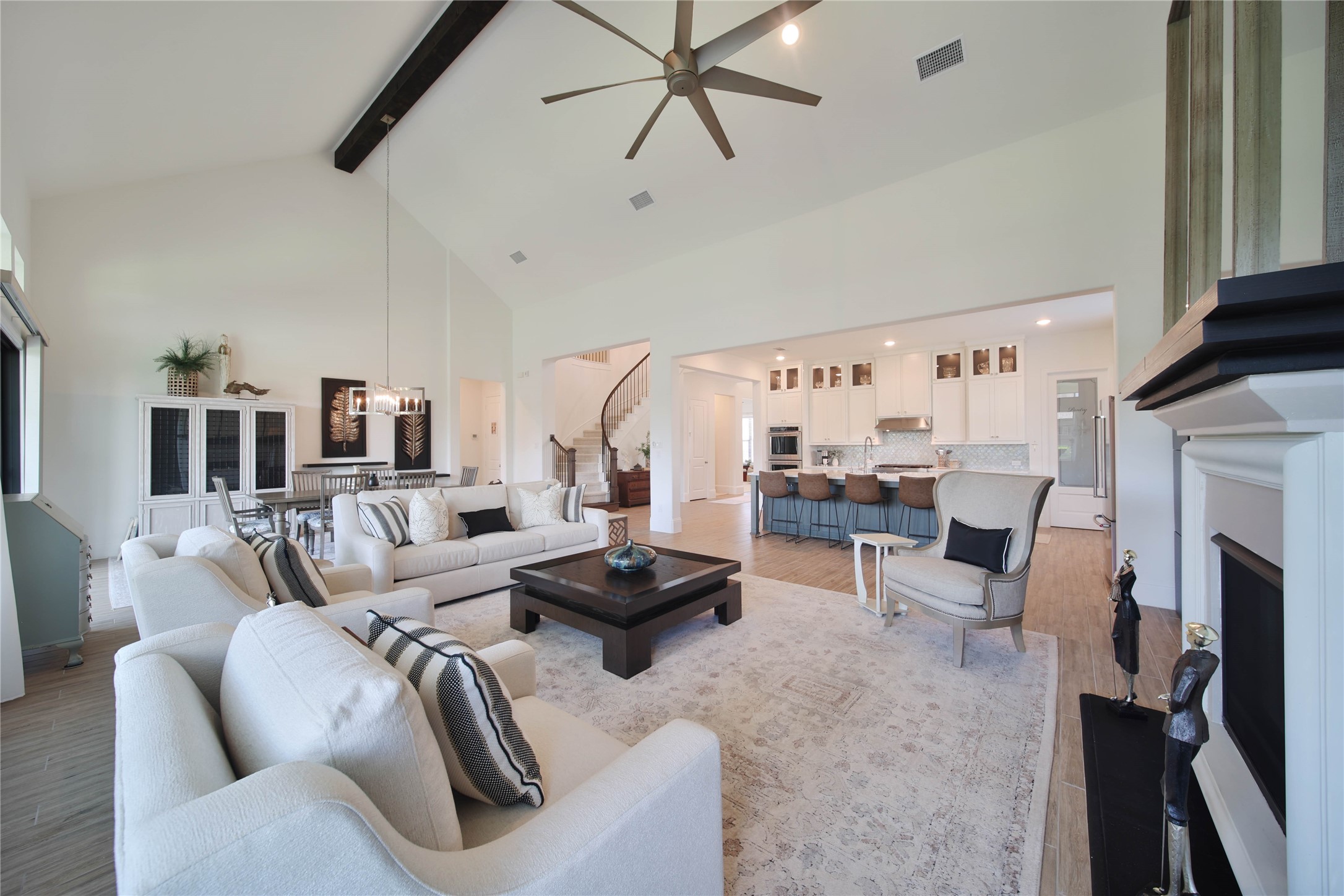 The open-concept floor plan creates a seamless flow between the living, dining, and kitchen areas, making everyday living and entertaining effortless.