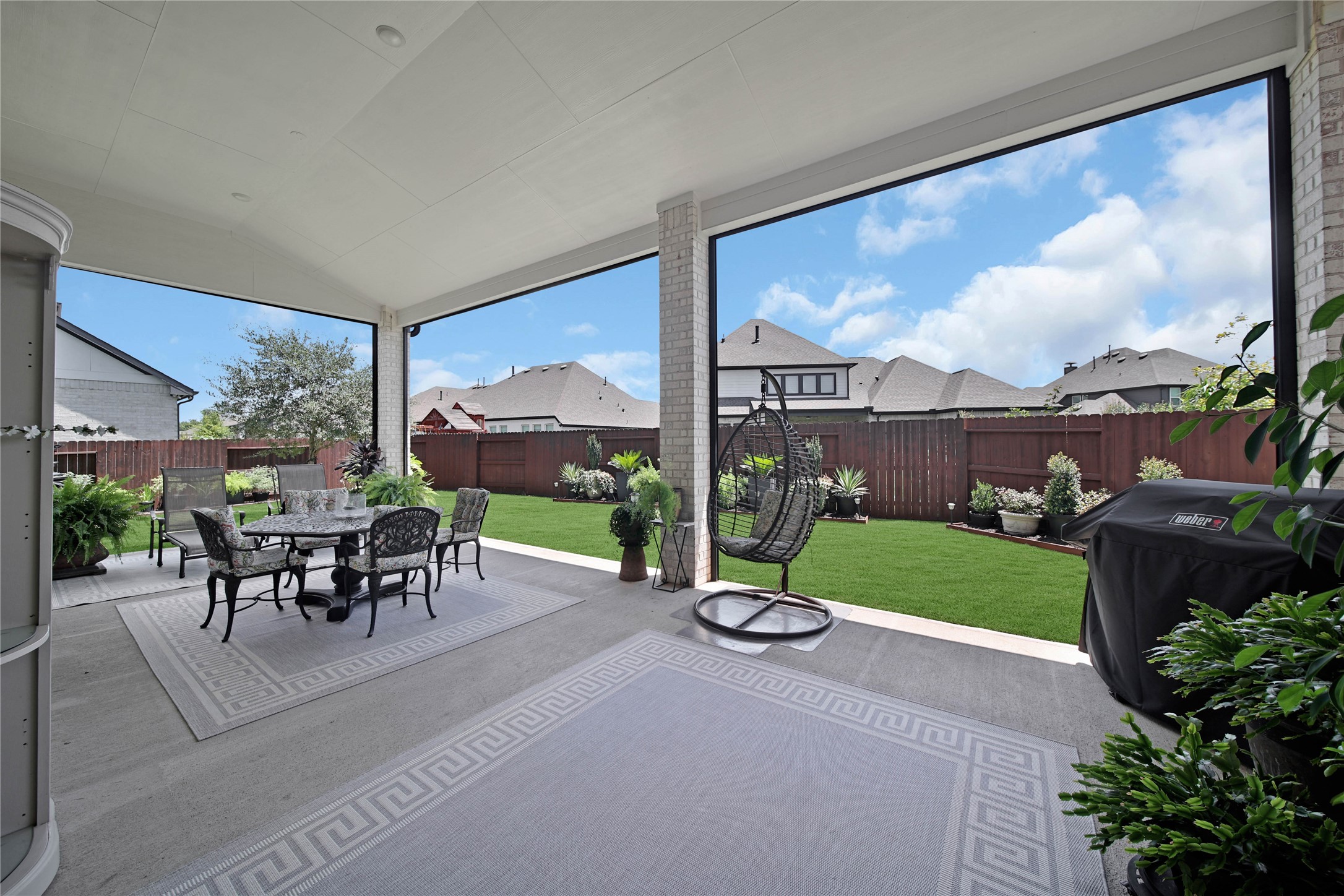 The extended covered patio invites you to step outside and enjoy even more space to relax, entertain, and make lasting memories.