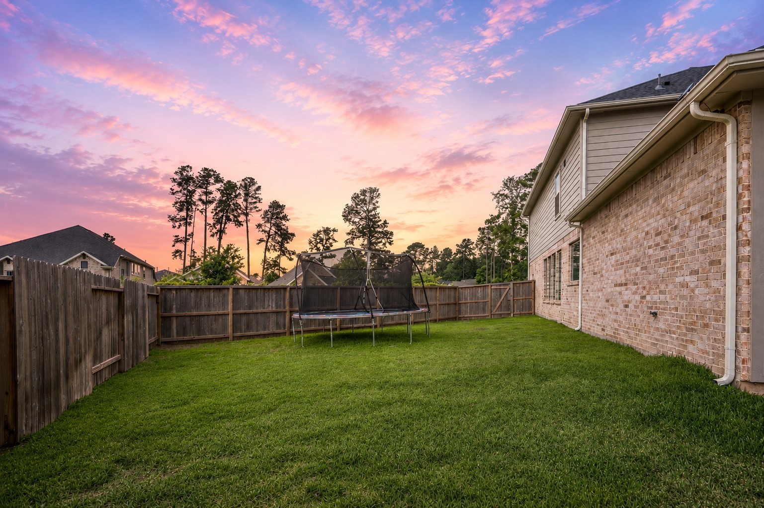 Ideal for family fun, this spacious lot includes a generously sized side yard as well.