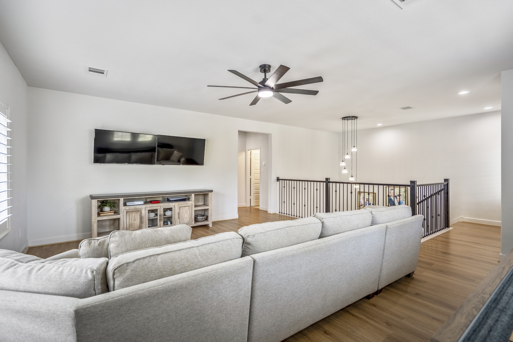Through that hallway is a full guest suite, two additional bedrooms and a full bath.