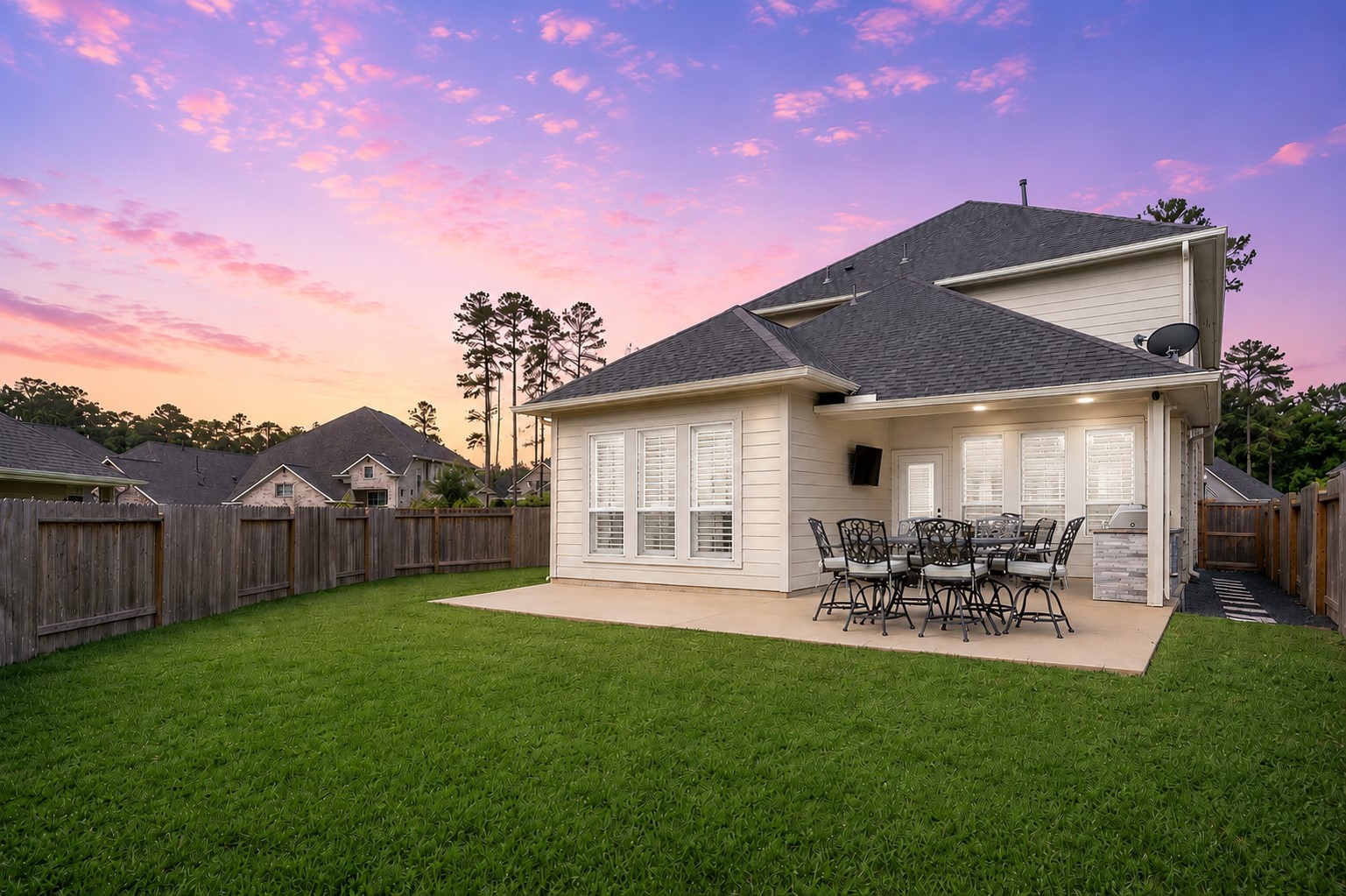 The patio was extended making summer nights a breeze with the built-in grill and mounted TV.