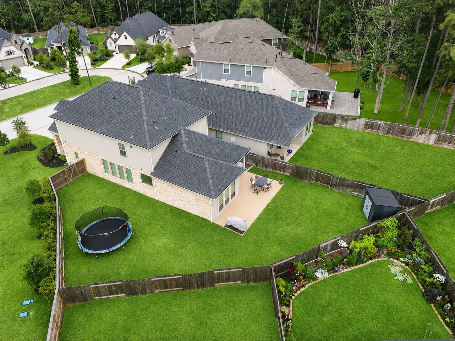 The property is situated on an expansive corner lot with ample green space and privacy.