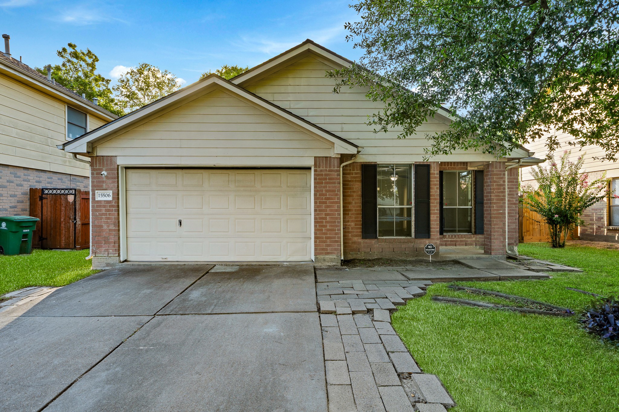Charming single-story home featuring a classic brick facade, a two-car garage, and a welcoming front porch. The manicured lawn and mature tree enhance its curb appeal. Charming single-story home featuring a classic brick facade, a two-car garage, and a welcoming front porch. The manicured lawn and mature tree enhance its curb appeal.