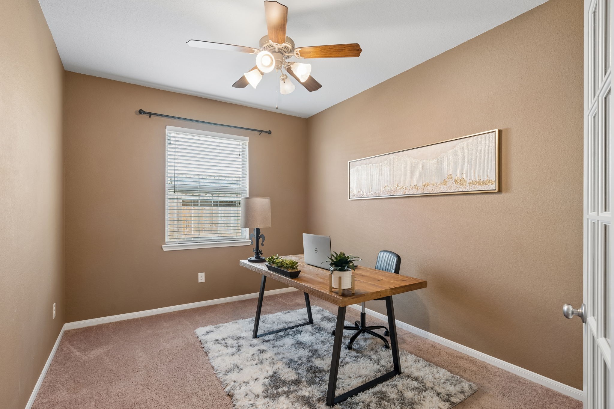 A home office designed for focus and flexibility. Natural light brightens the room, while the comfortable layout provides space for a desk, bookshelves or a personalized workspace