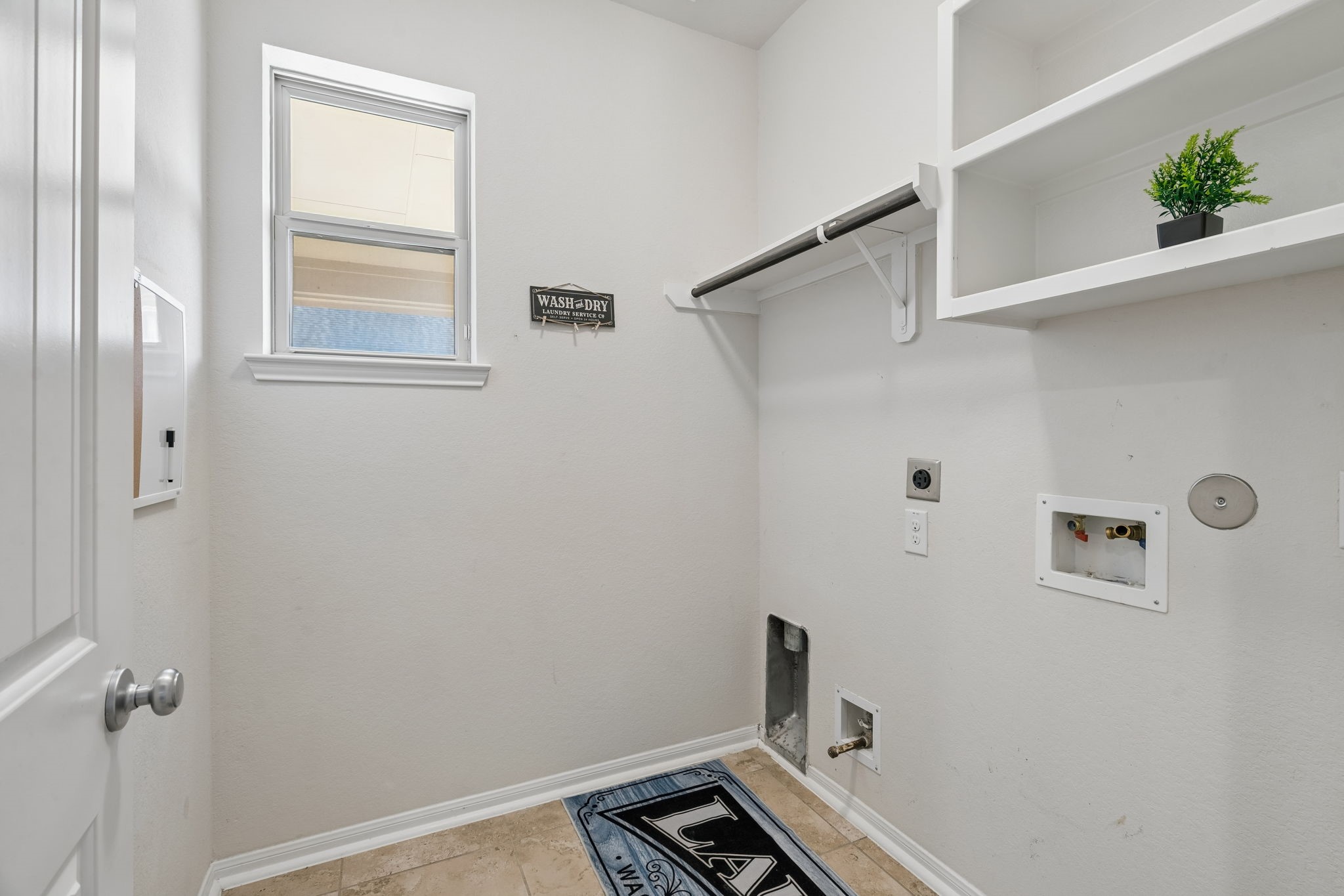 A dedicated laundry room keeps everyday chores organized and out of sight