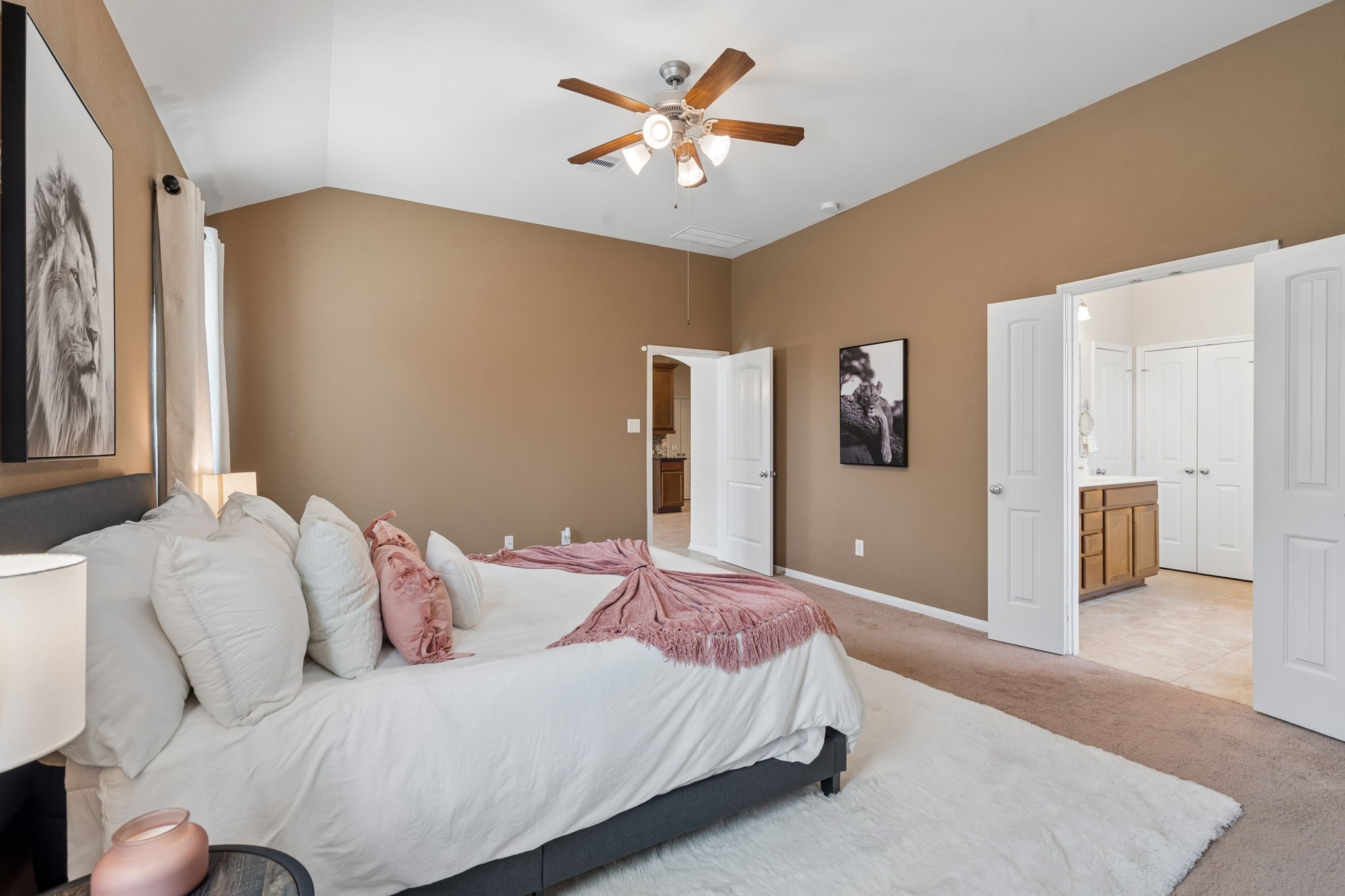 High ceilings, a spacious layout and thoughtful separation from the bathroom create a comfortable setting for daily living
