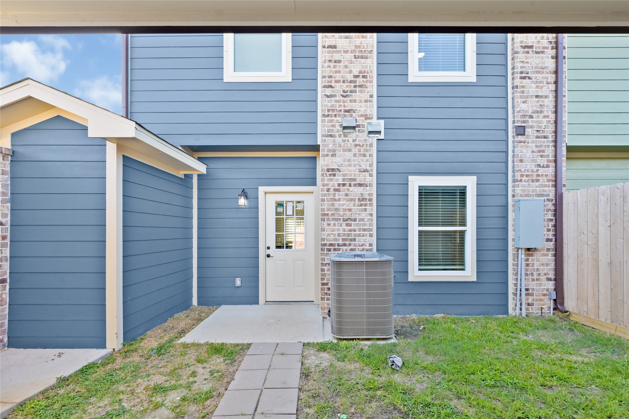 Outdoor space from garage to back door