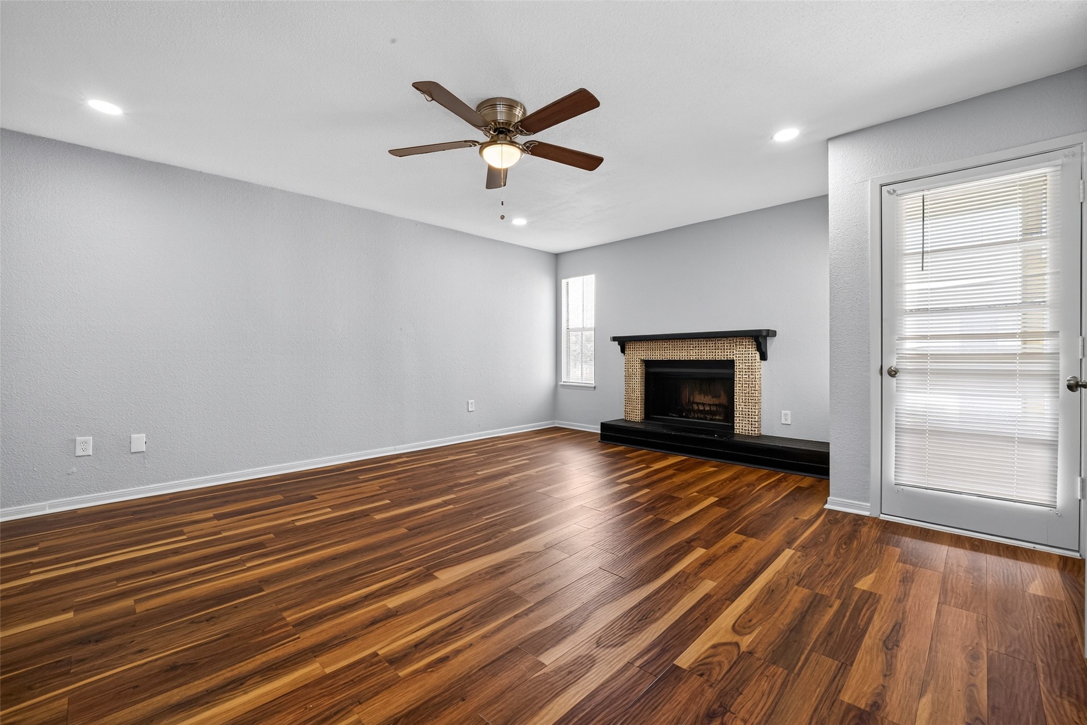 Primary Bedroom with a Fireplace
