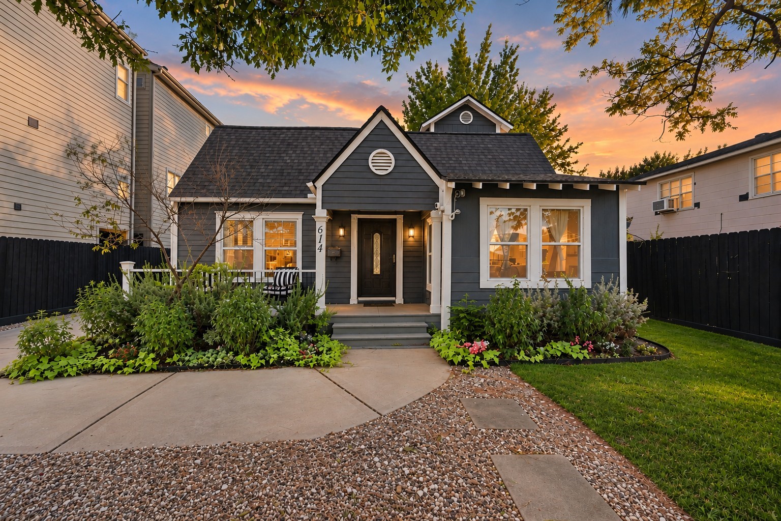Dark siding and warm evening light give the front a strong first impression.