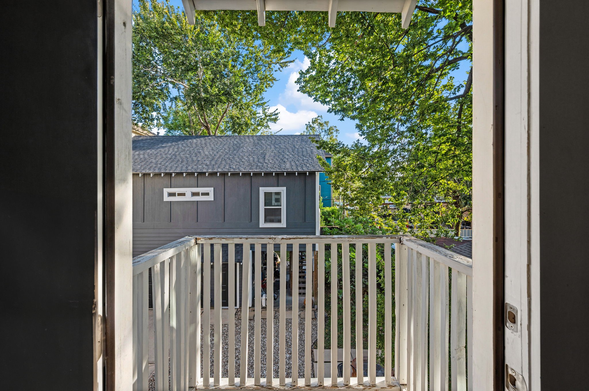 A covered deck off the back of the home.