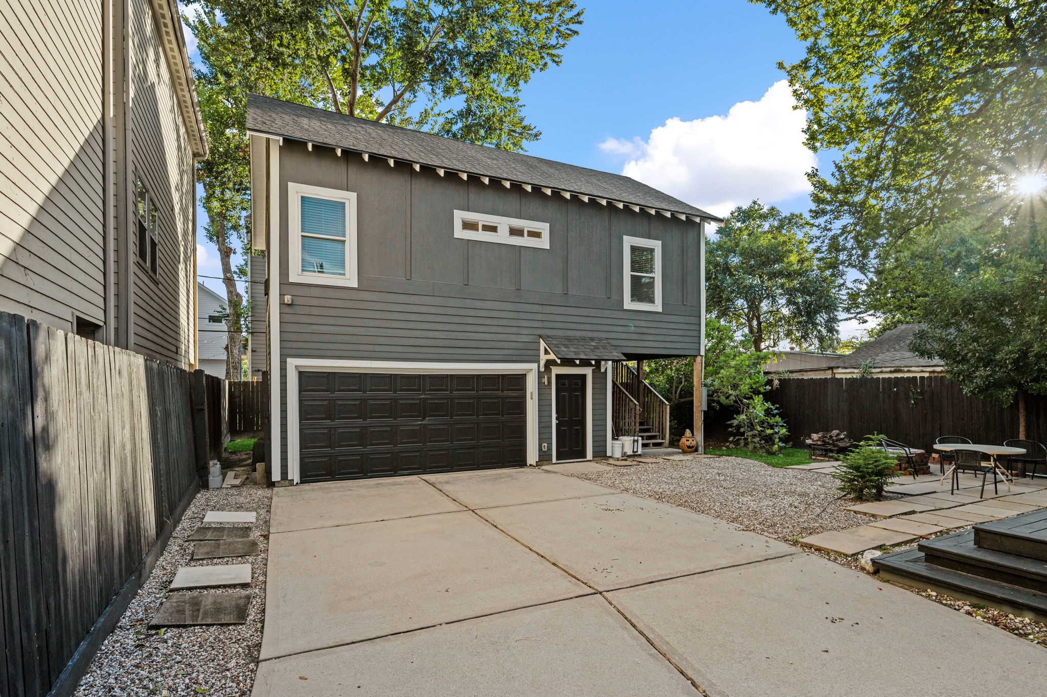 A detached garage with driveway parking.