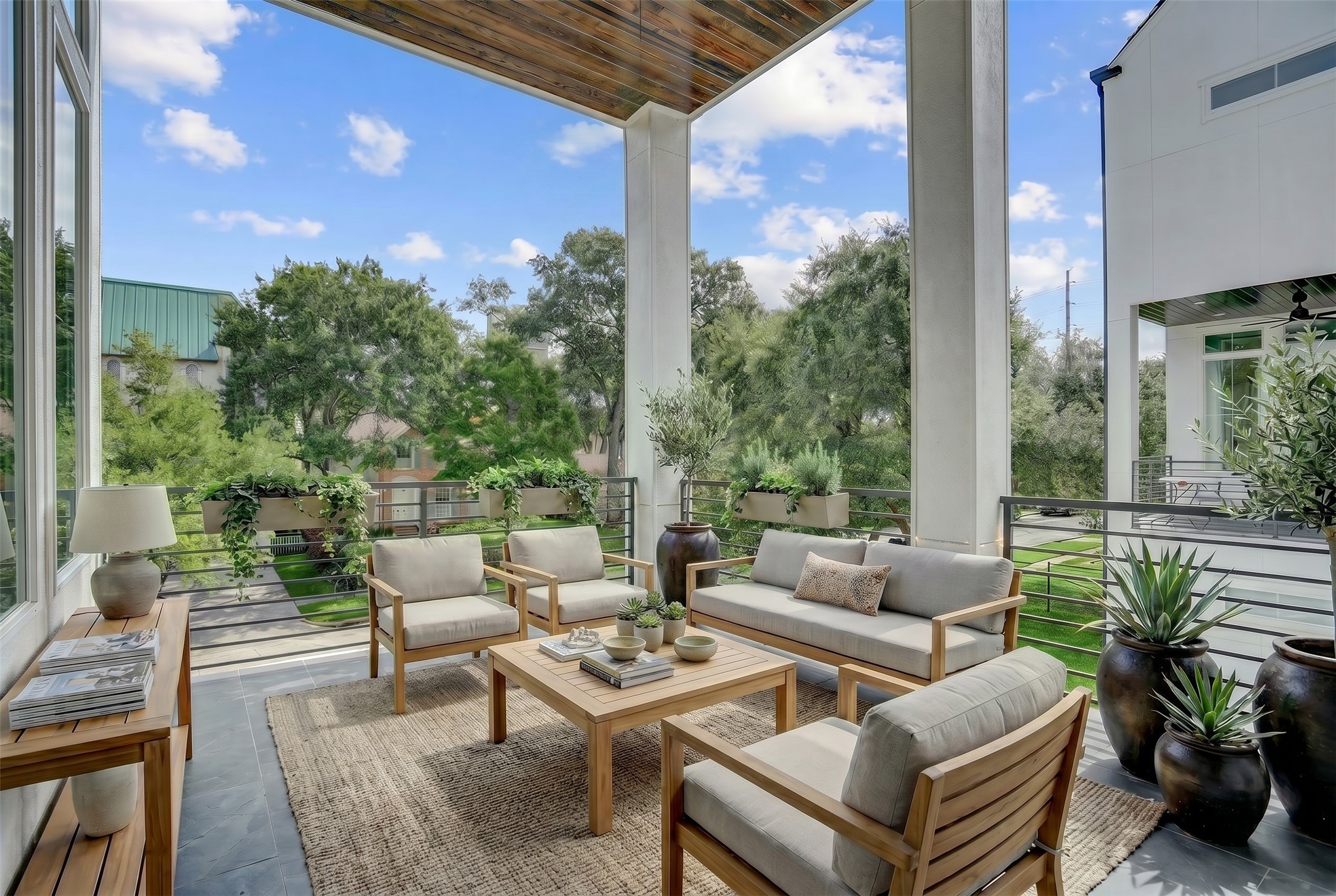The covered terrace off the kitchen offers a fantastic living or dining space with a natural gas connection. Virtually staged photo. The covered terrace off the kitchen offers a fantastic living or dining space with a natural gas connection. Virtually staged photo.