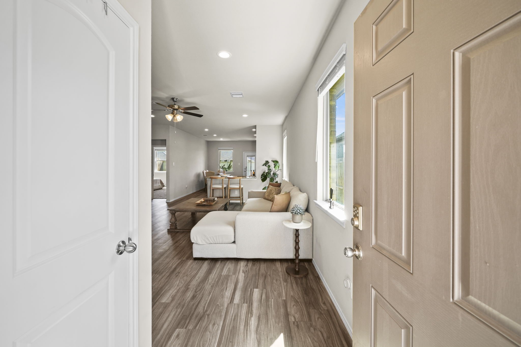 Welcoming entryway that opens into a bright, inviting living space with a seamless flow throughout the home.