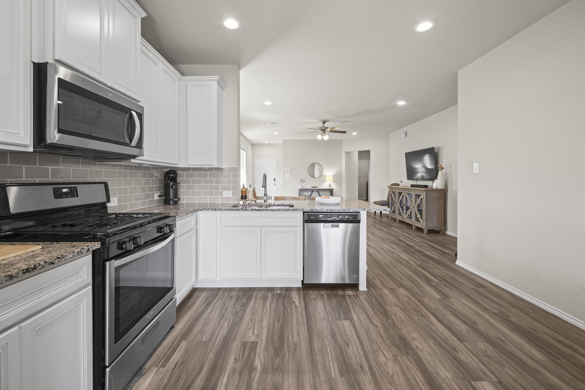 Open kitchen overlooking the living room, creating an inviting space where cooking, conversation, and everyday living come together.