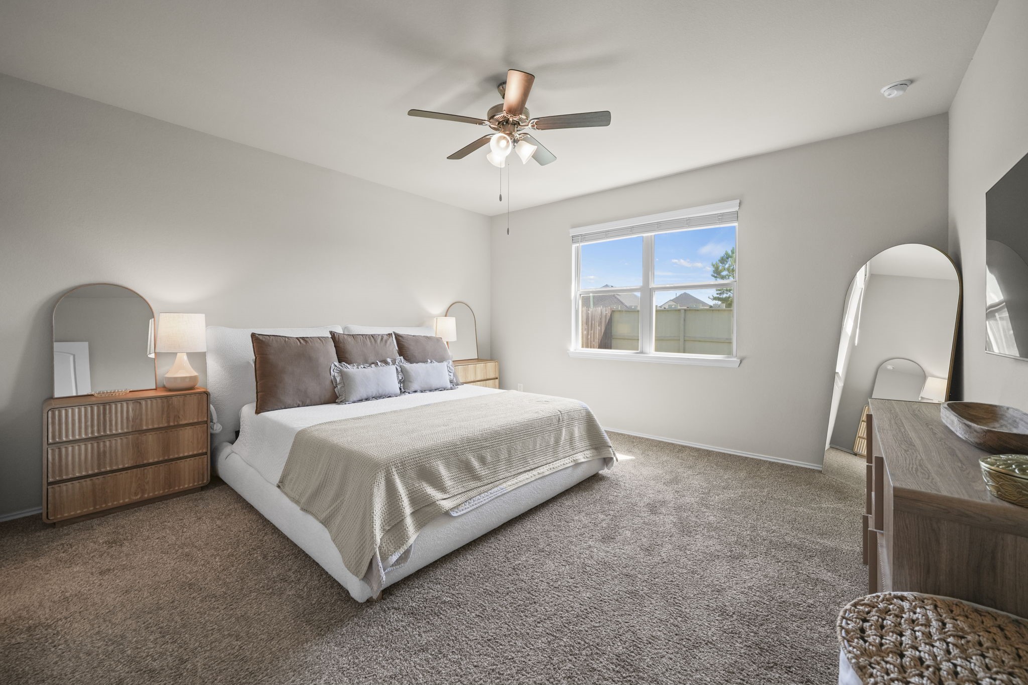 Comfortable primary bedroom offering a peaceful retreat with natural light and space to unwind.