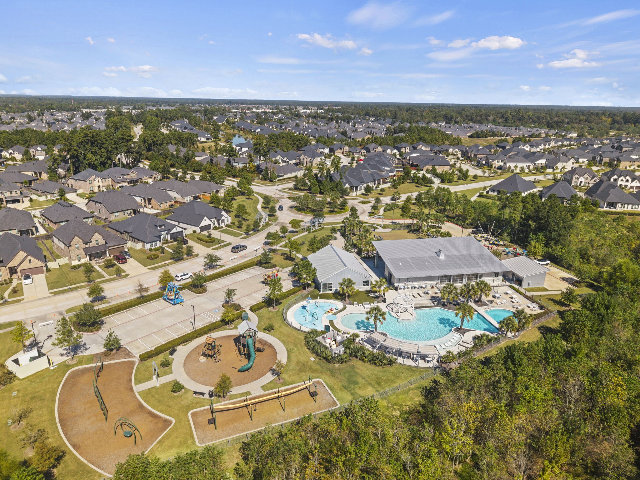 Enjoy resort-style community amenities featuring a clubhouse, sparkling pool, splash pad, playground, and scenic walking trails.
