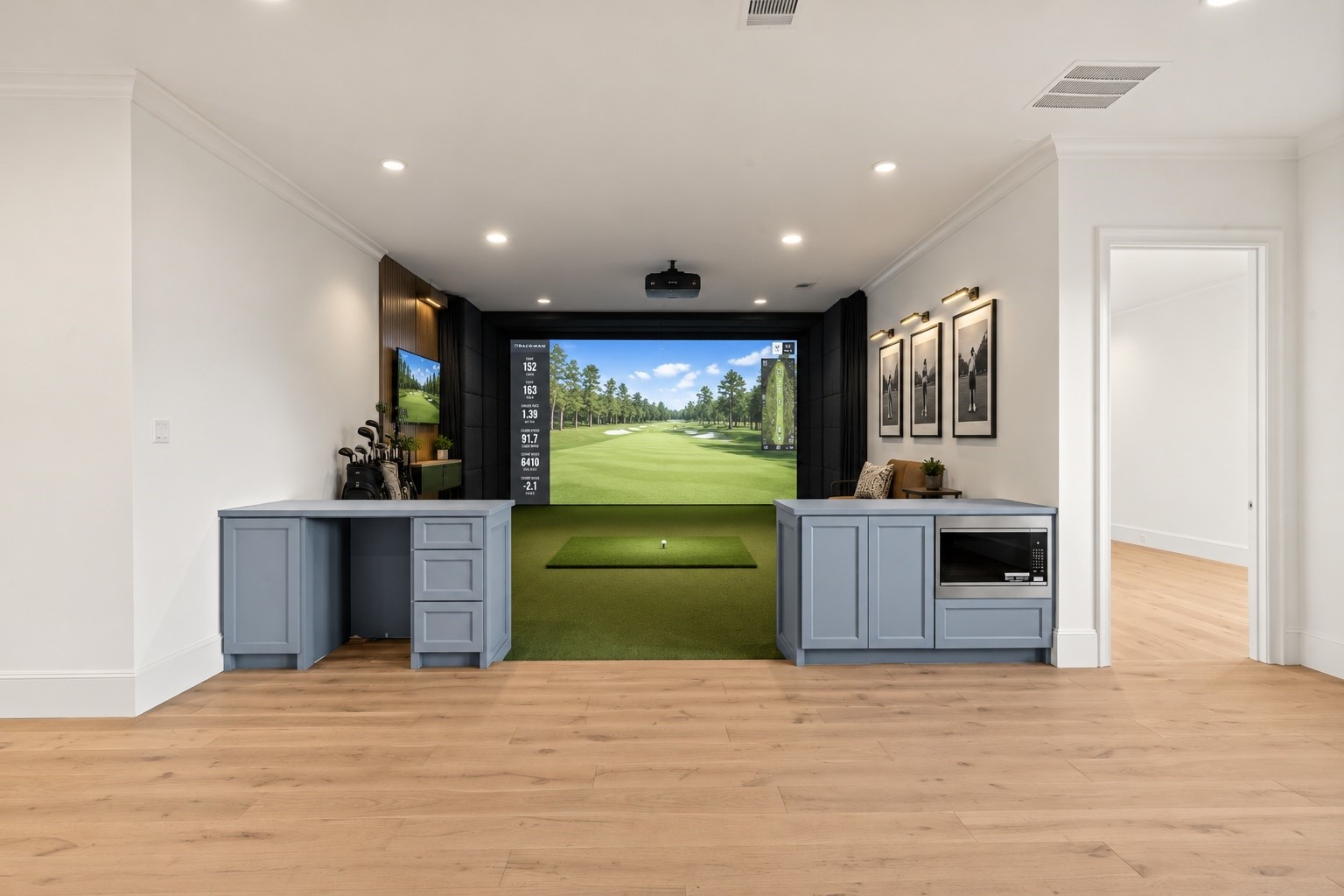 *Golf simulator lounge concept, virtually staged to illustrate a potential use of the space. Ceiling height accommodates the possibility of a golf simulator installation. Image is for inspirational purposes only.*