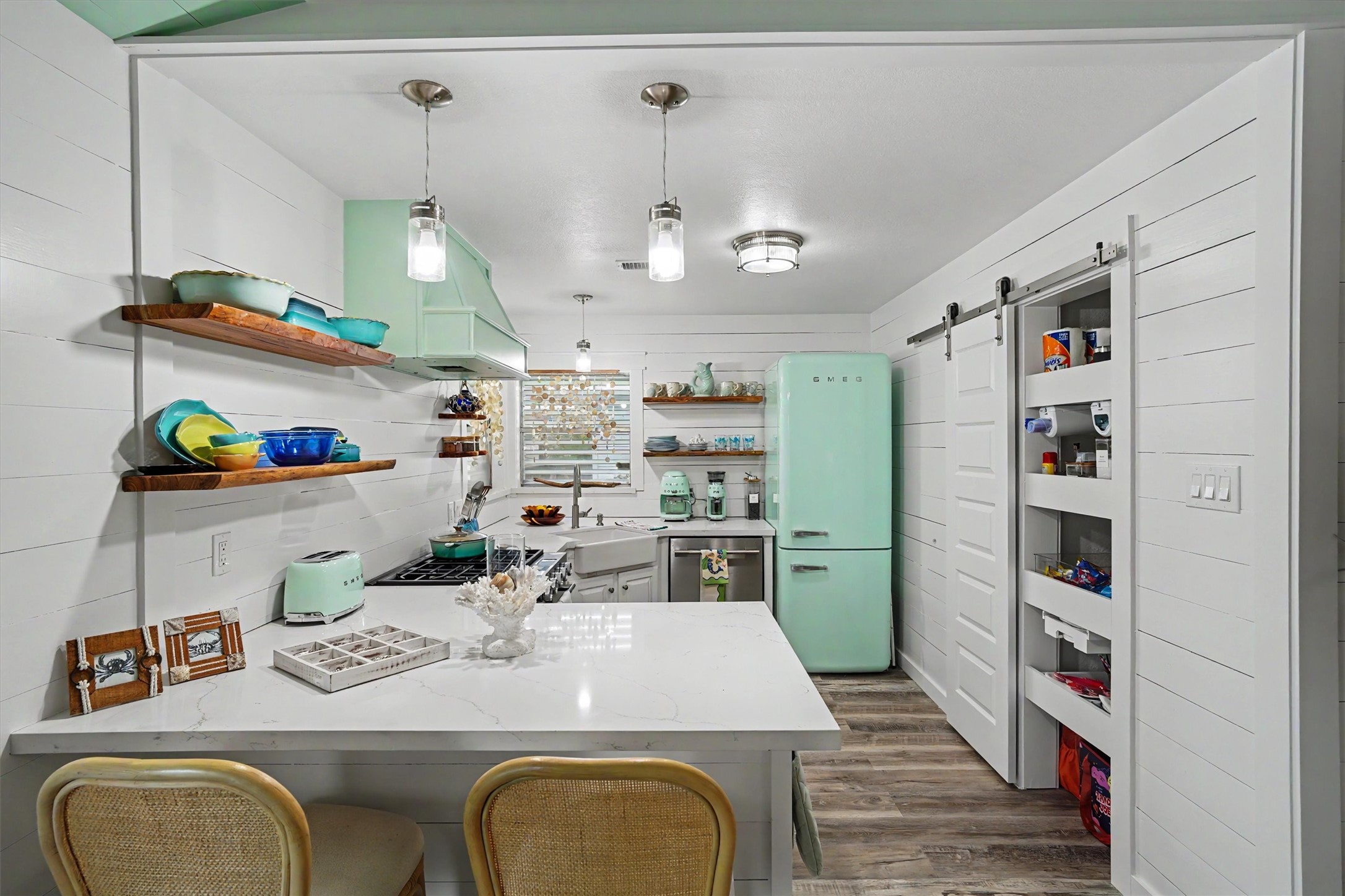 Every inch of this updated kitchen was maximized for storage, style, and everyday convenienceincluding a pantry with pull-out shelves! Every inch of this updated kitchen was maximized for storage, style, and everyday convenienceincluding a pantry with pull-out shelves!