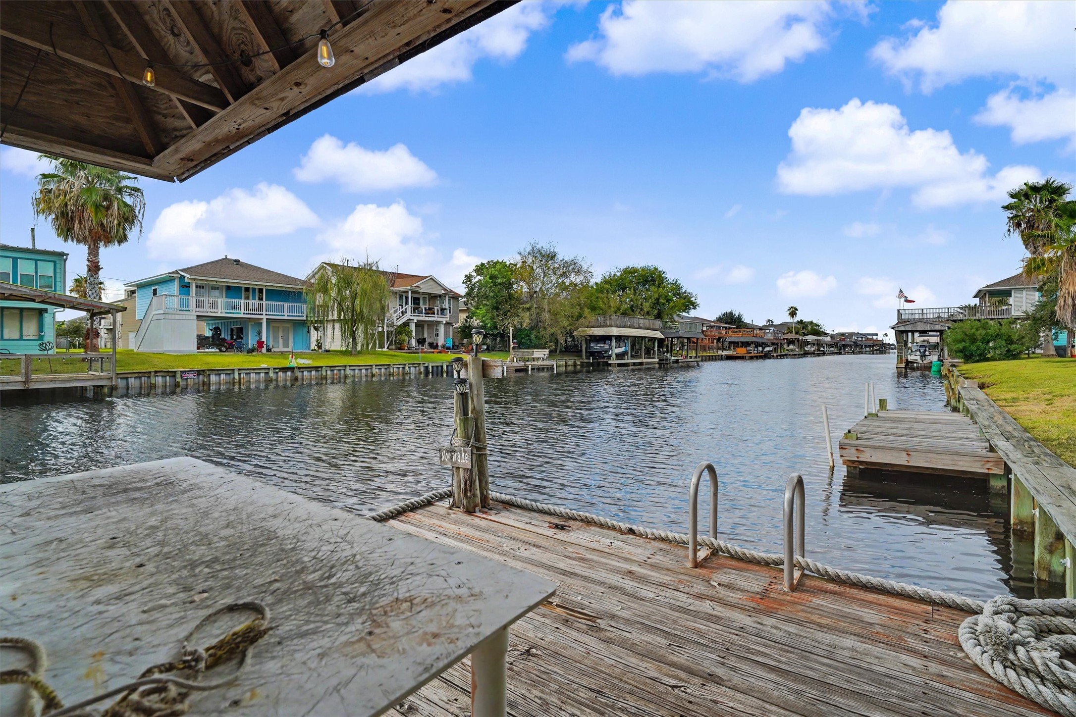 A well-equipped waterfront dock with a fish-cleaning station and water-access laddereverything you need to make the most of waterfront living