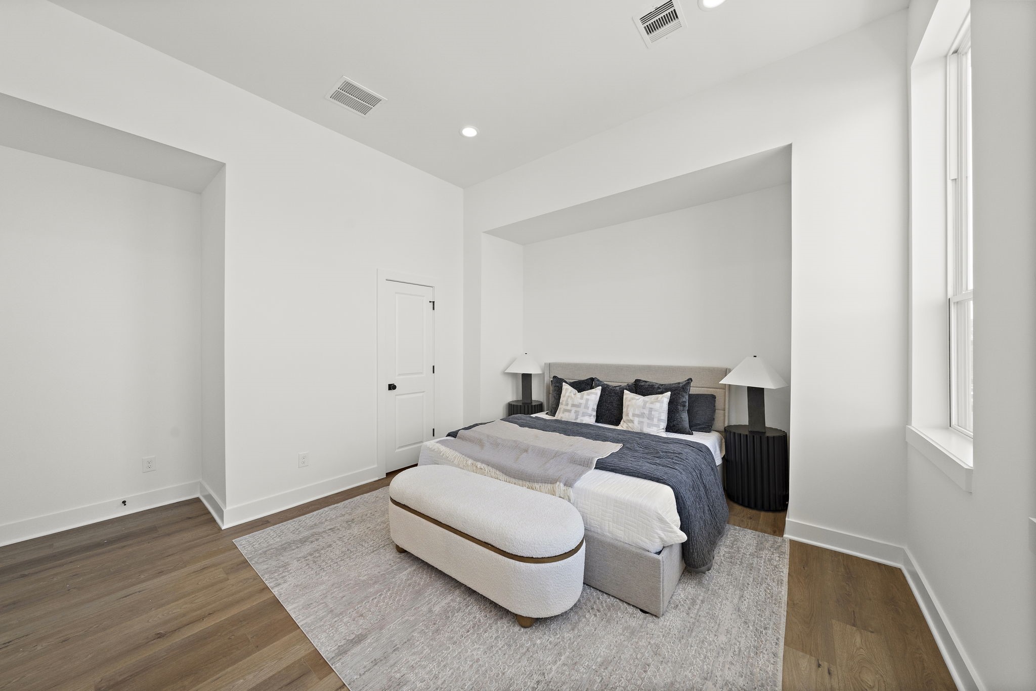Primary Bedroom with large walk-in closet and attached primary bath suite.