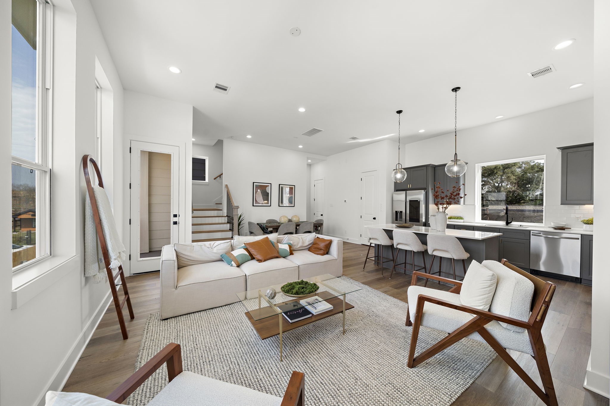 Experience a spacious living room seamlessly connected to a private balcony, perfect for relaxation and entertaining.
