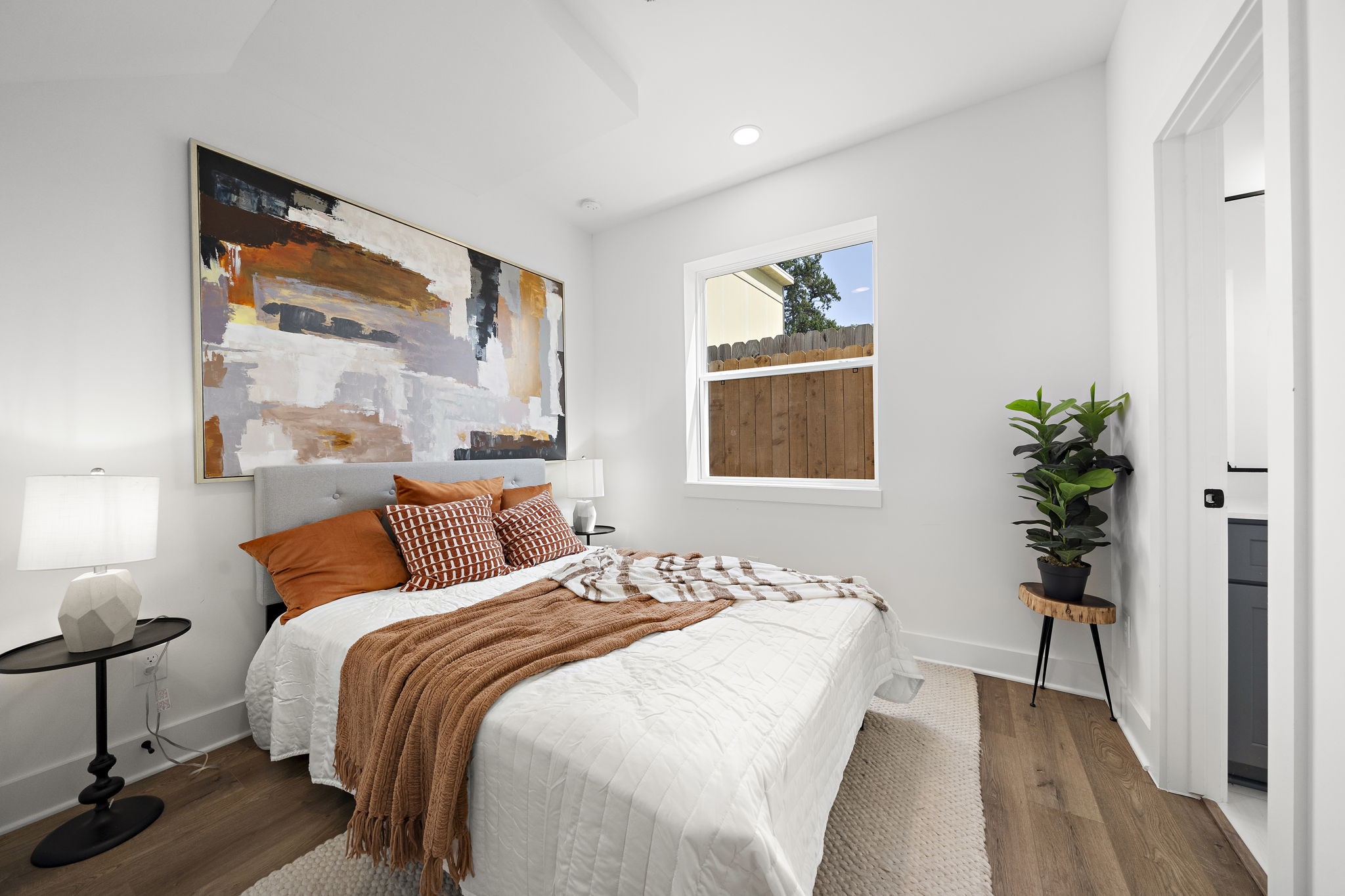 Versatile first-floor bedroom with private full bathroom, perfect as an office or guest suite.