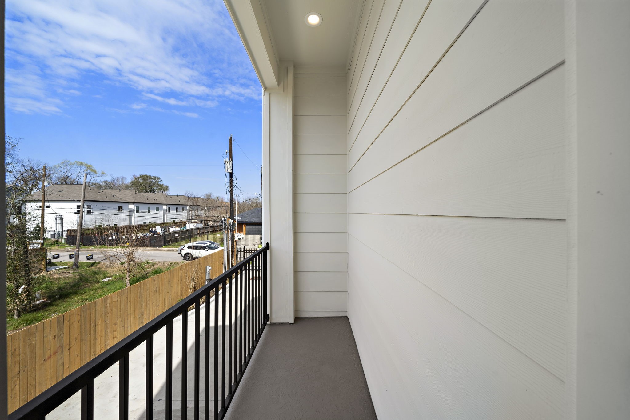 An inviting balcony offering fresh air and a serene view, perfect for relaxation or a morning coffee.