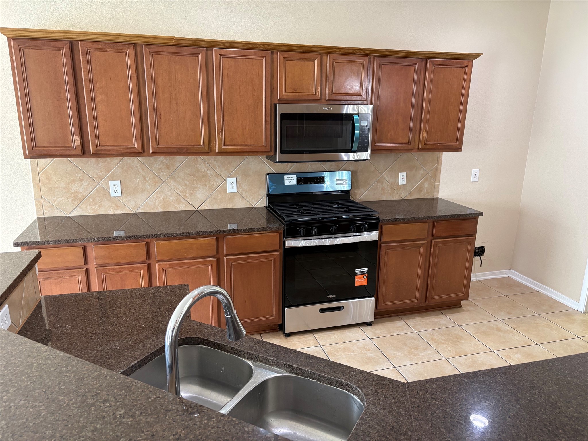 NEW gas range, new microwave, new dishwasher NEW gas range, new microwave, new dishwasher