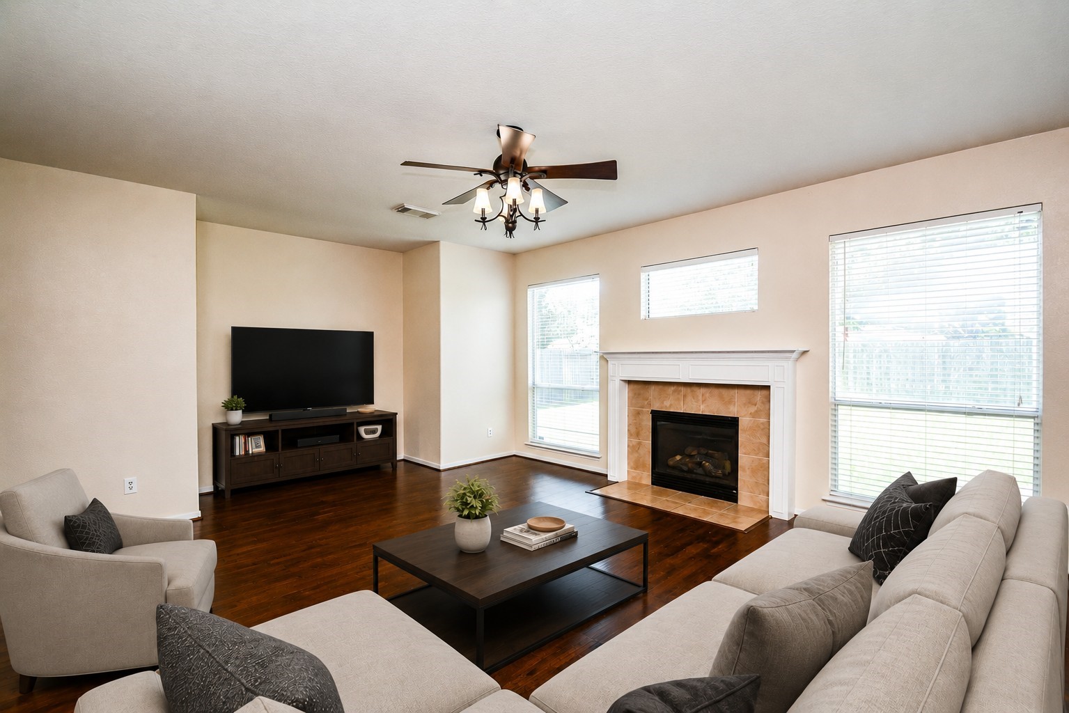 Spacious family room with fireplace and lots of natural light and beautiful flooring *virtually staged* Spacious family room with fireplace and lots of natural light and beautiful flooring *virtually staged*