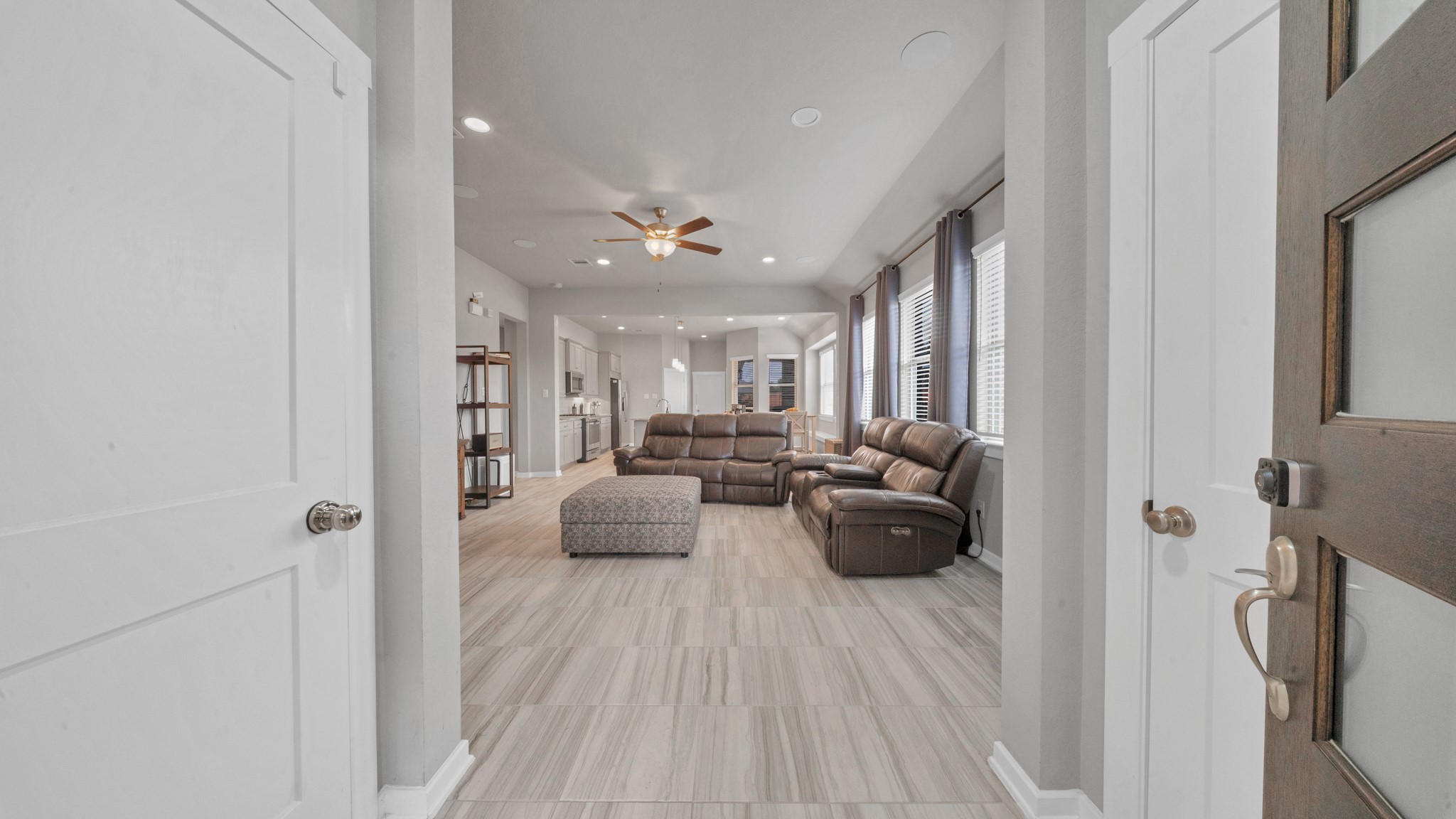 Bright, open entry leading to spacious living and kitchen areas with tile throughout. Bright, open entry leading to spacious living and kitchen areas with tile throughout.