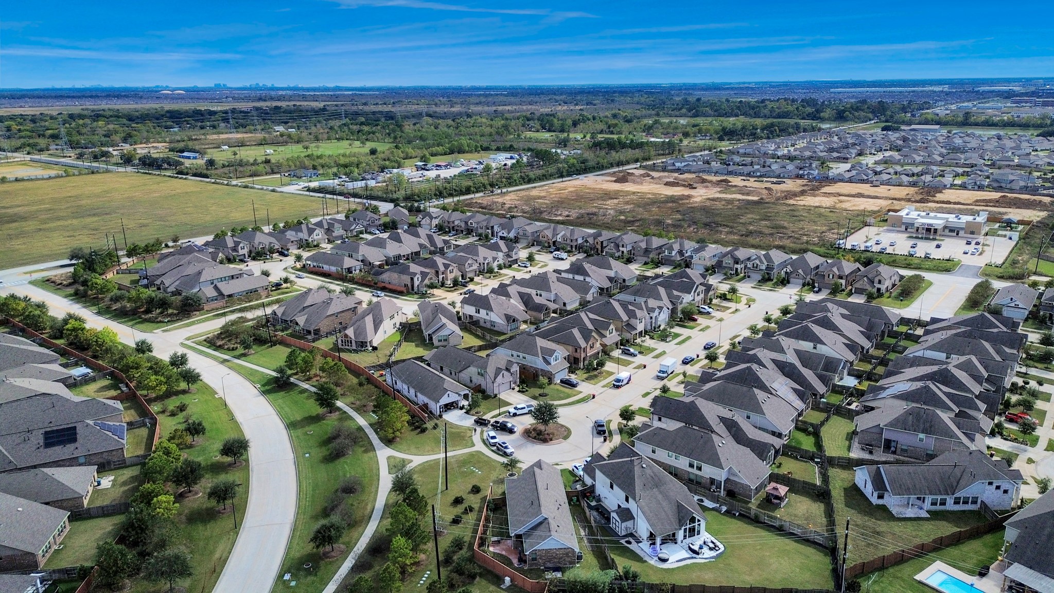 Beautiful aerial view showcasing peaceful streets, lakes, and well-maintained homes.