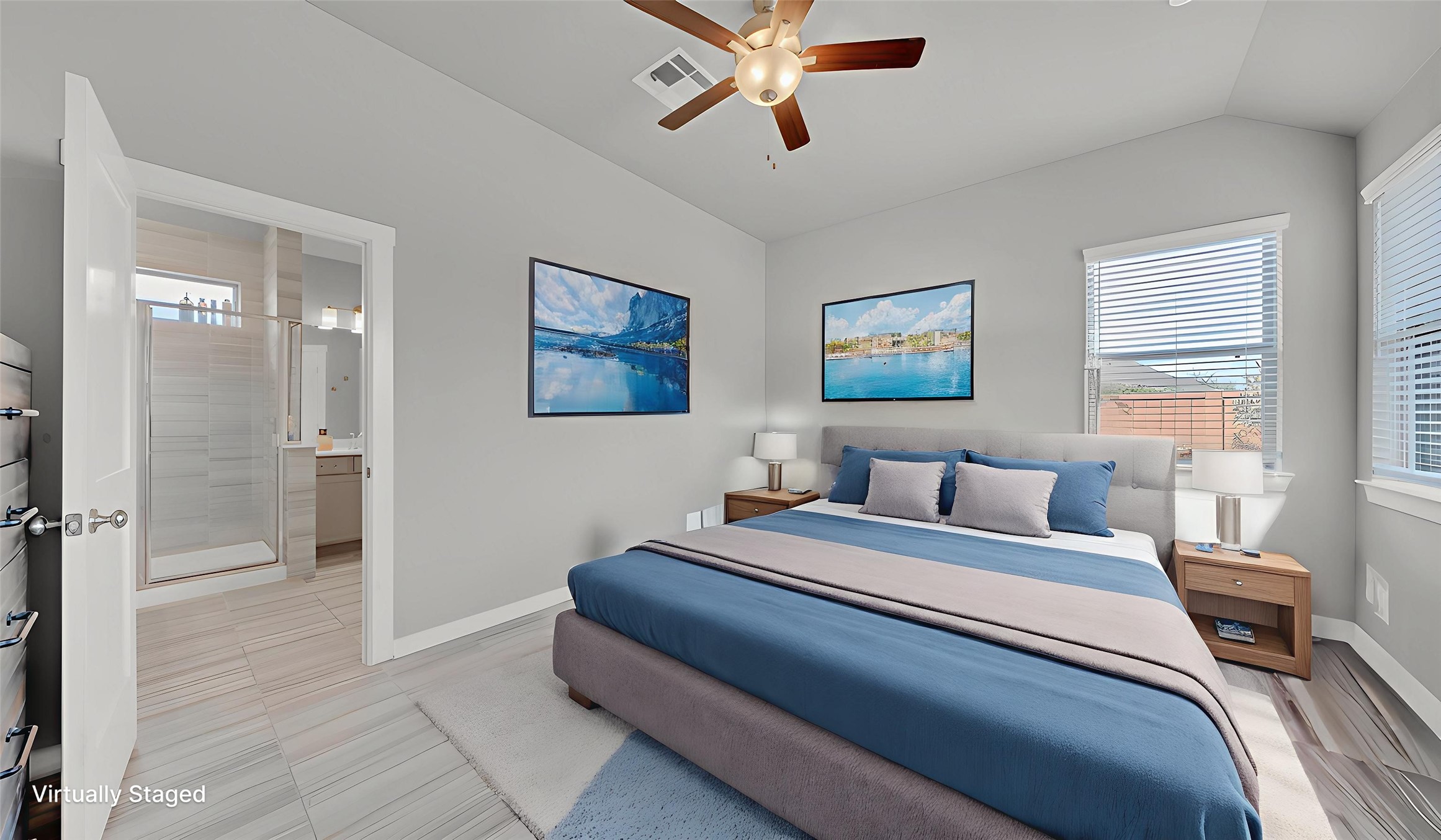 Bright primary suite with high ceilings and direct access to the ensuite bathroom.
