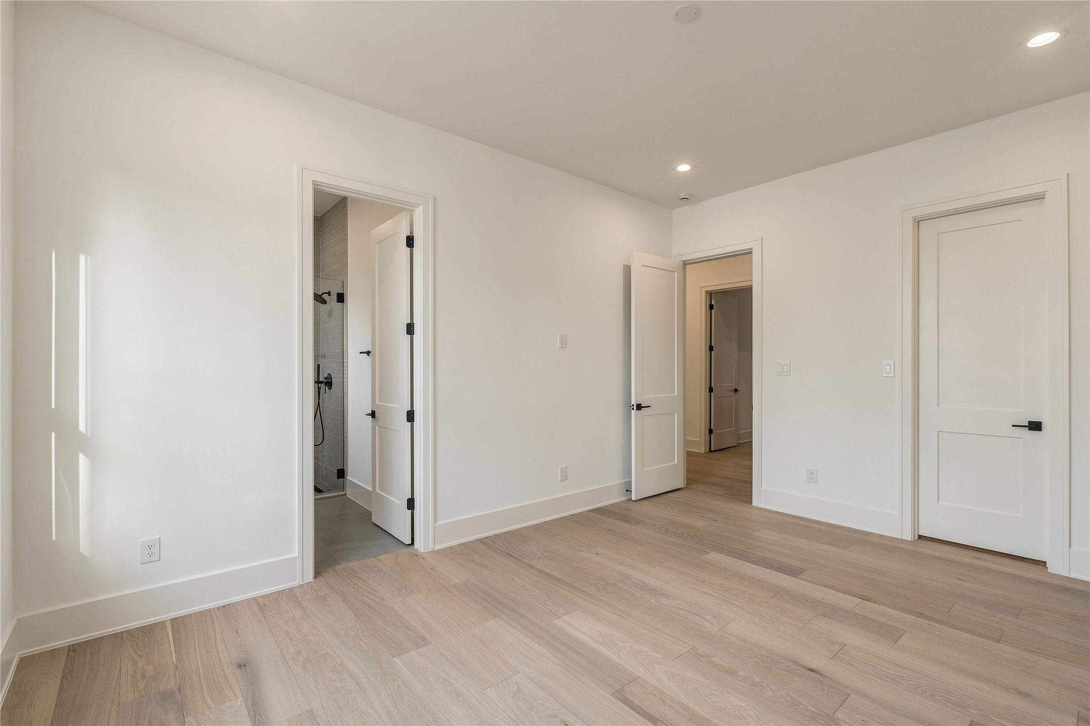 Another generously sized secondary bedroom offers excellent flexibility for guests or family, with a clean, open layout ready to be personalized.