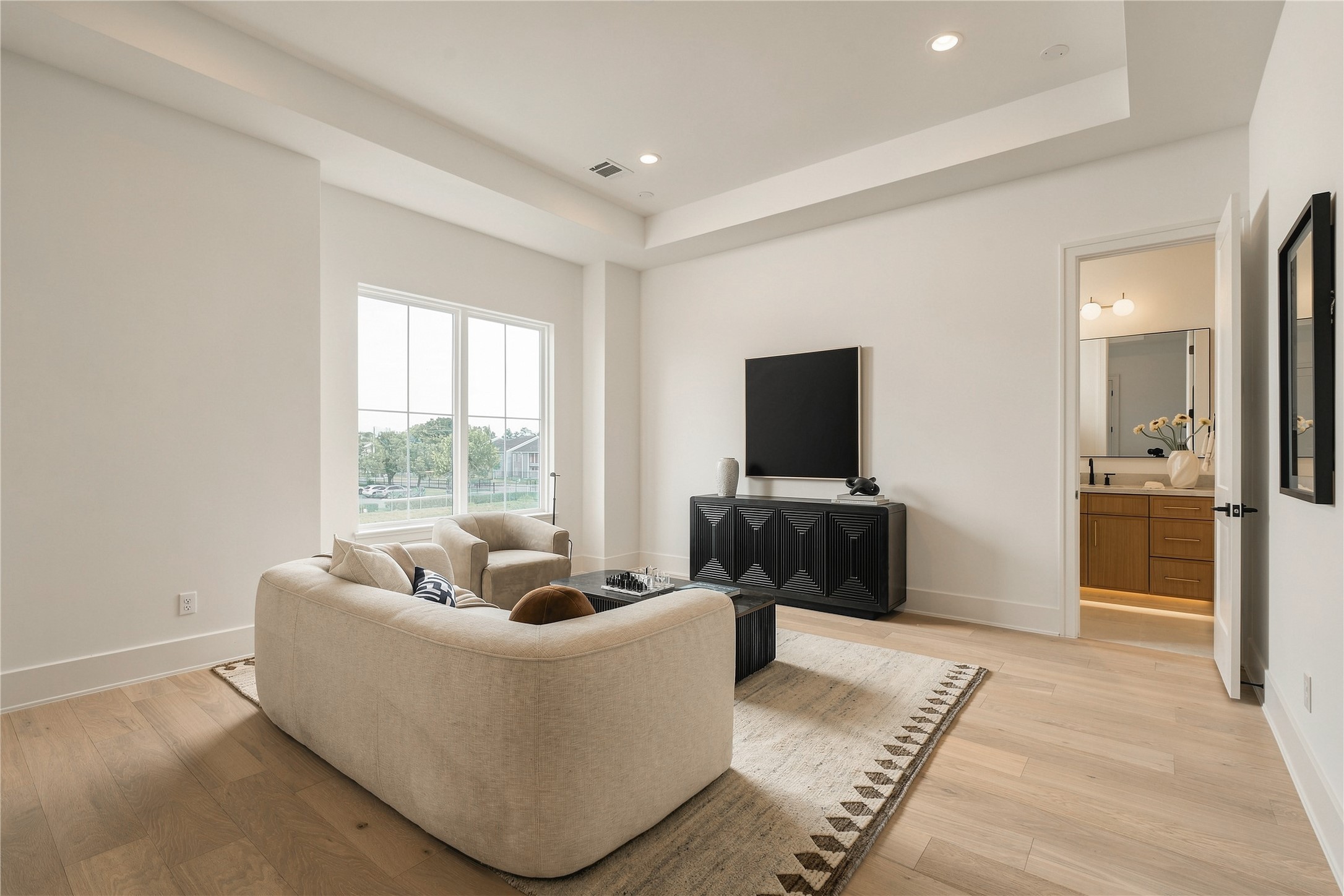 A second perspective highlights the game rooms generous scale and flexibility, offering ample space for movie nights, game days, or a relaxed secondary lounge.