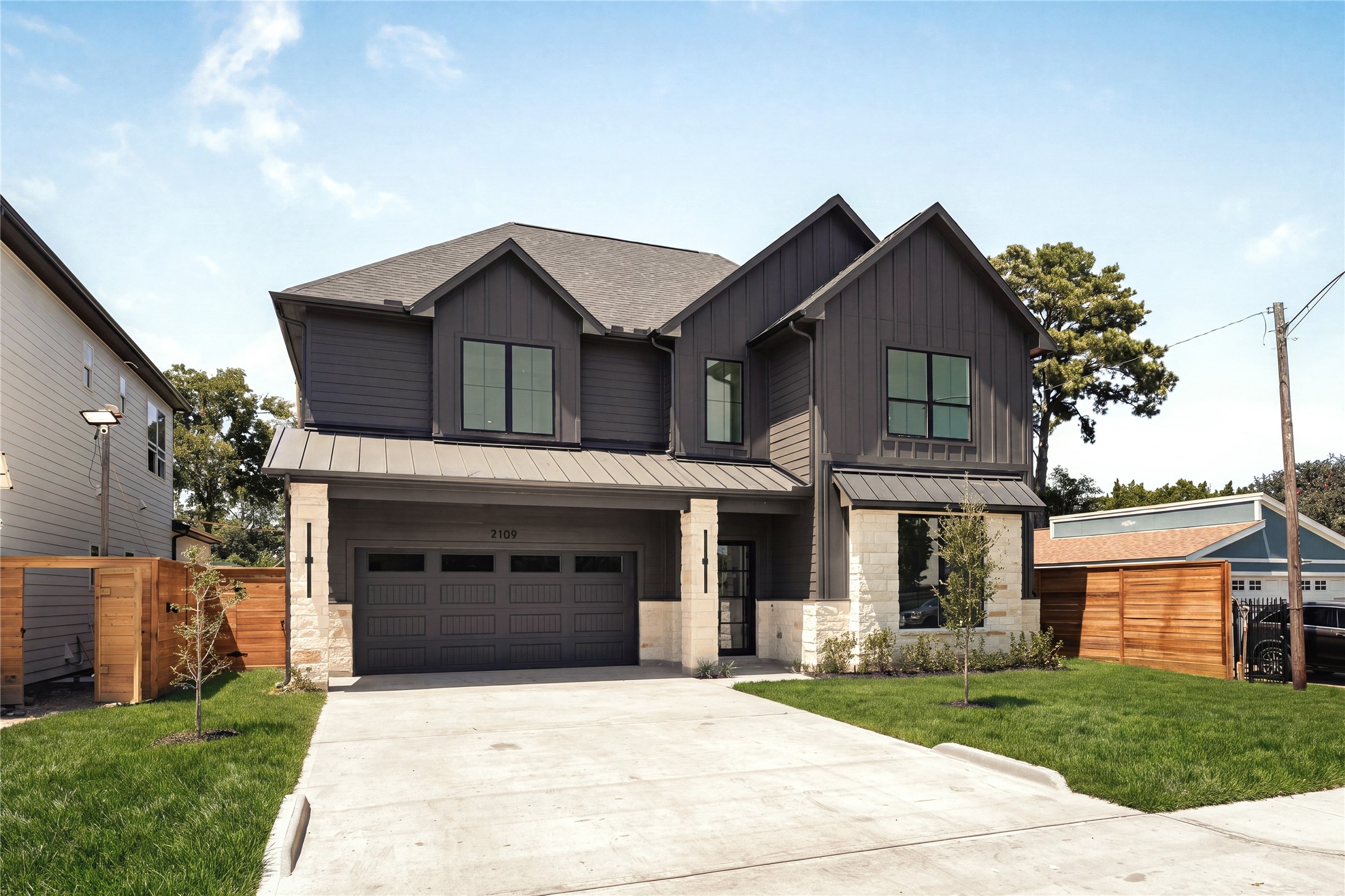 Welcome to 2109 McKean Drive, where Nima Homes brings a refined point of view to modern luxury living in Spring Branch, a modern farmhouse masterpiece with an exterior that feels considered from every angle.