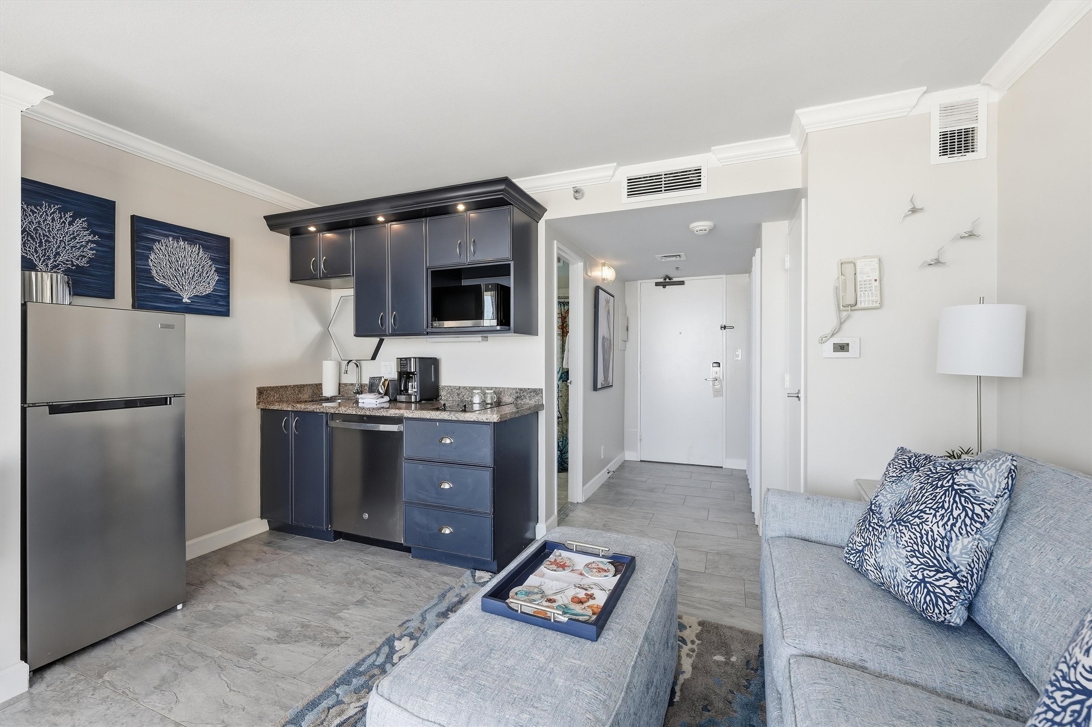 An efficient layout brings the kitchenette and living space together in one inviting setting. An efficient layout brings the kitchenette and living space together in one inviting setting.