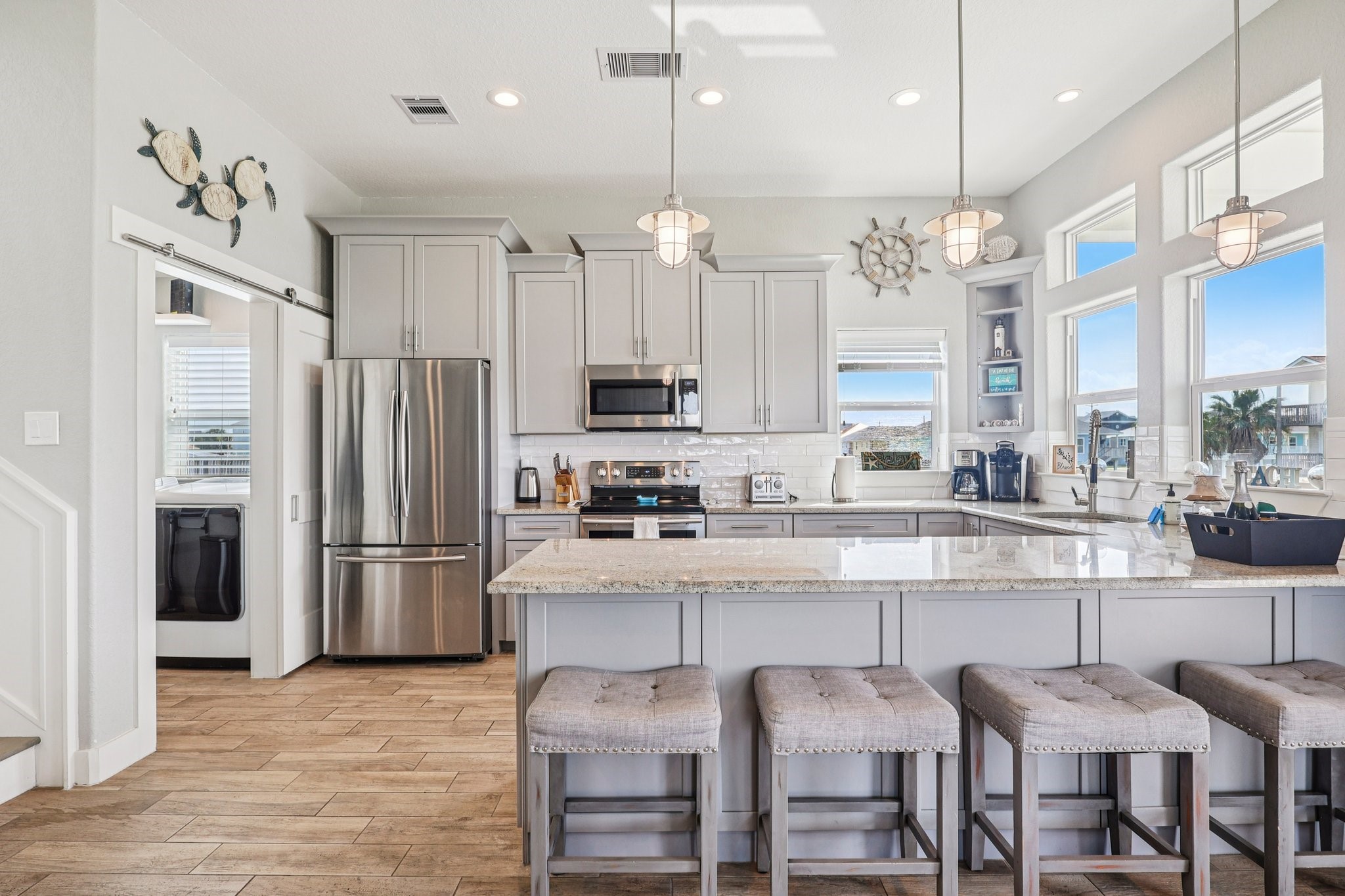 Extra-long granite bar perfect for
 entertaining all of your guest.