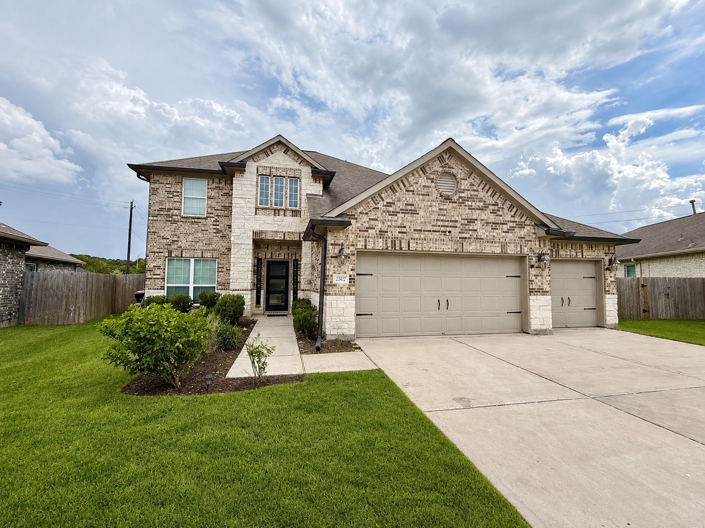 Exterior of home with 3 car garage. Exterior of home with 3 car garage.