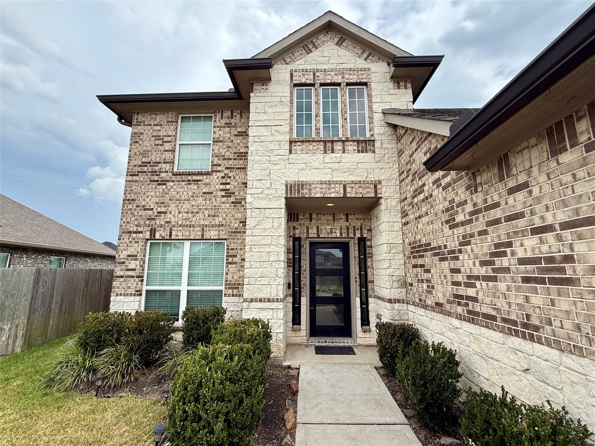 Beautiful entry with modern front door. Beautiful entry with modern front door.