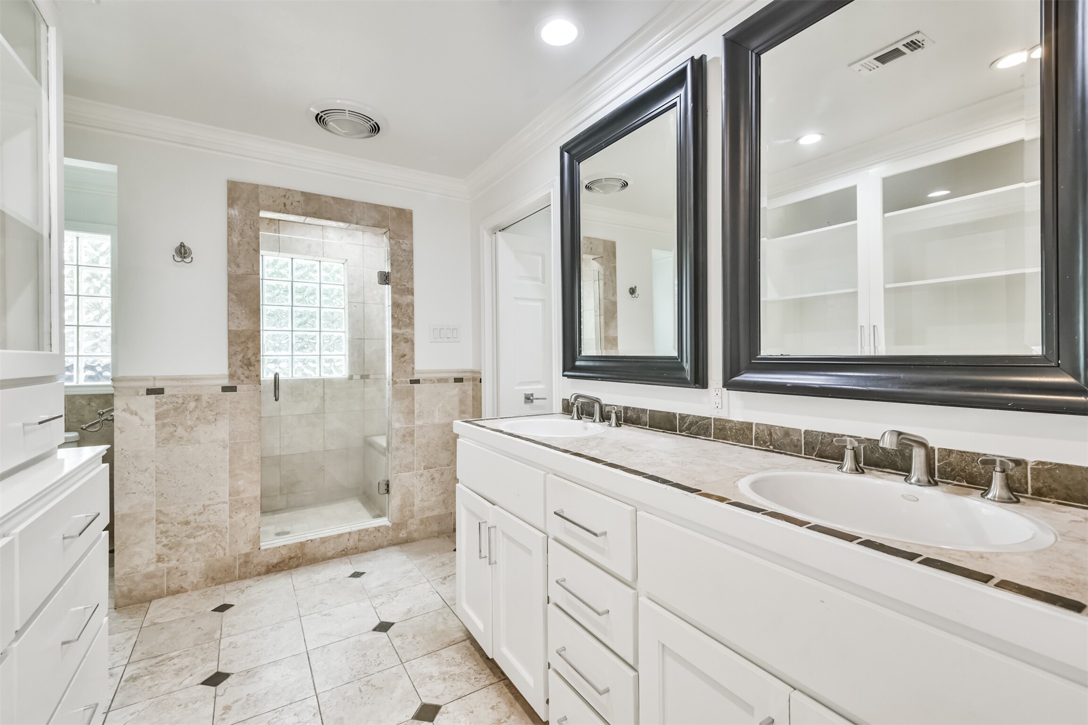 on-suite with custom tile and spa like amenities
