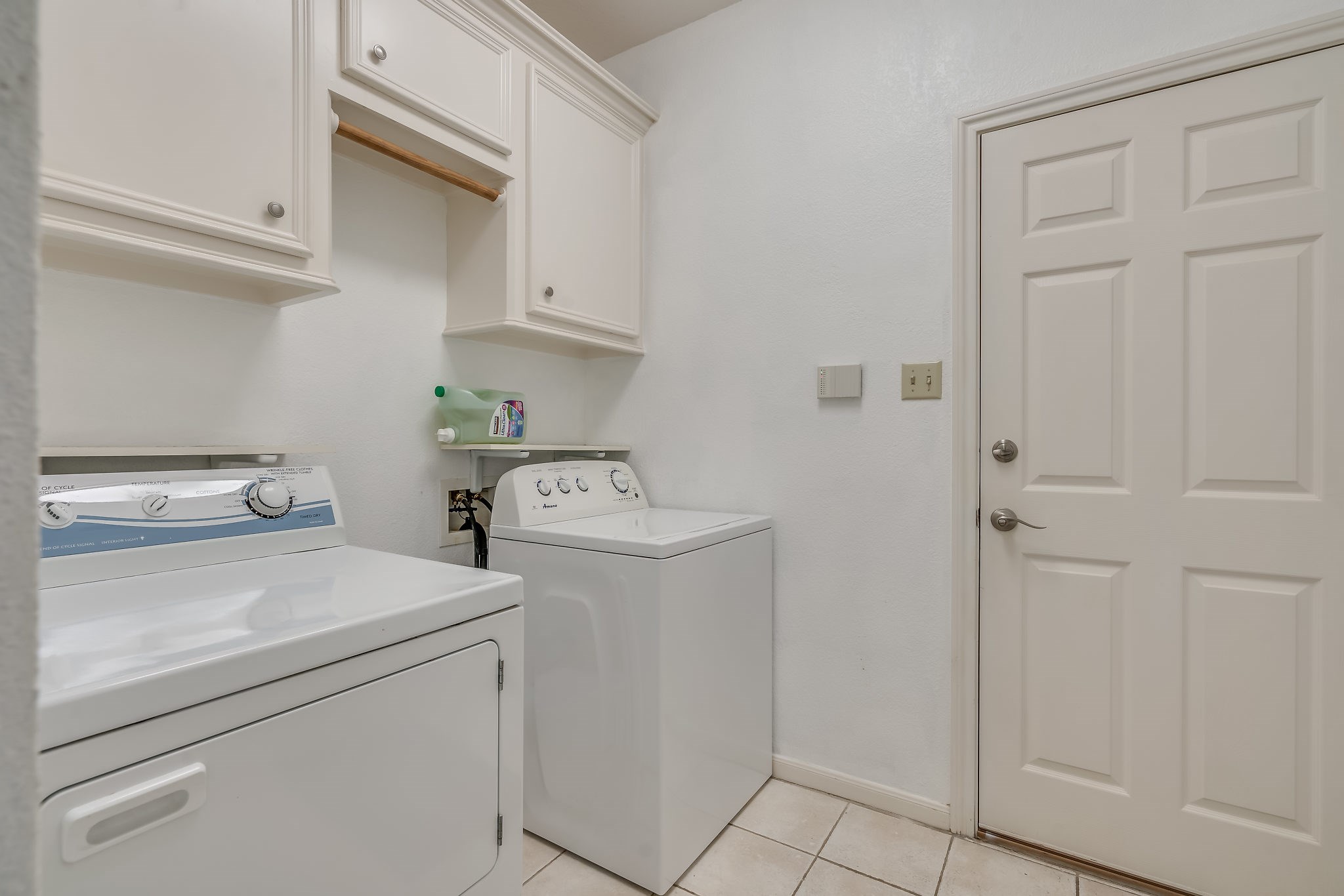 Discover convenience with this spacious utility room located right off the garage, perfect for seamless laundry days