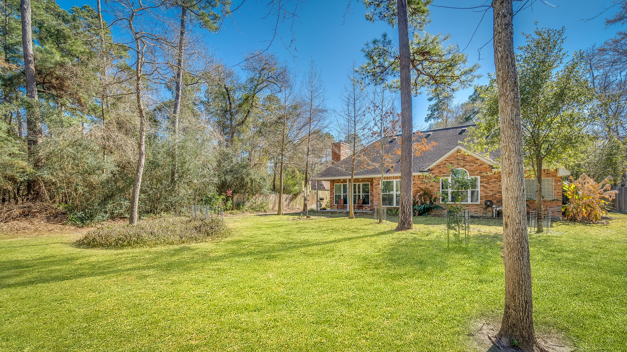 Discover the perfect blend of nature and potential in this expansive backyard, offering ample space to create your dream oasis, complete with room for a pool