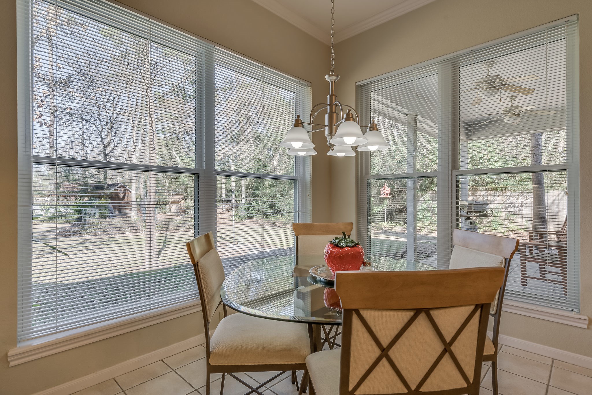 Enjoy your morning coffee while birdwatching in this cozy breakfast nook with a stunning garden view