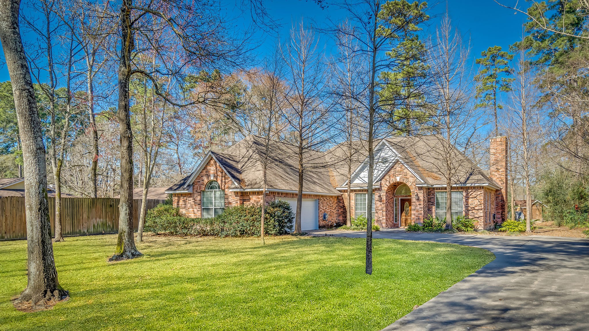 Nestled in a prime location, this secluded home boasts majestic trees, ample parking, and a recent roof, making it a perfect haven for discerning buyers