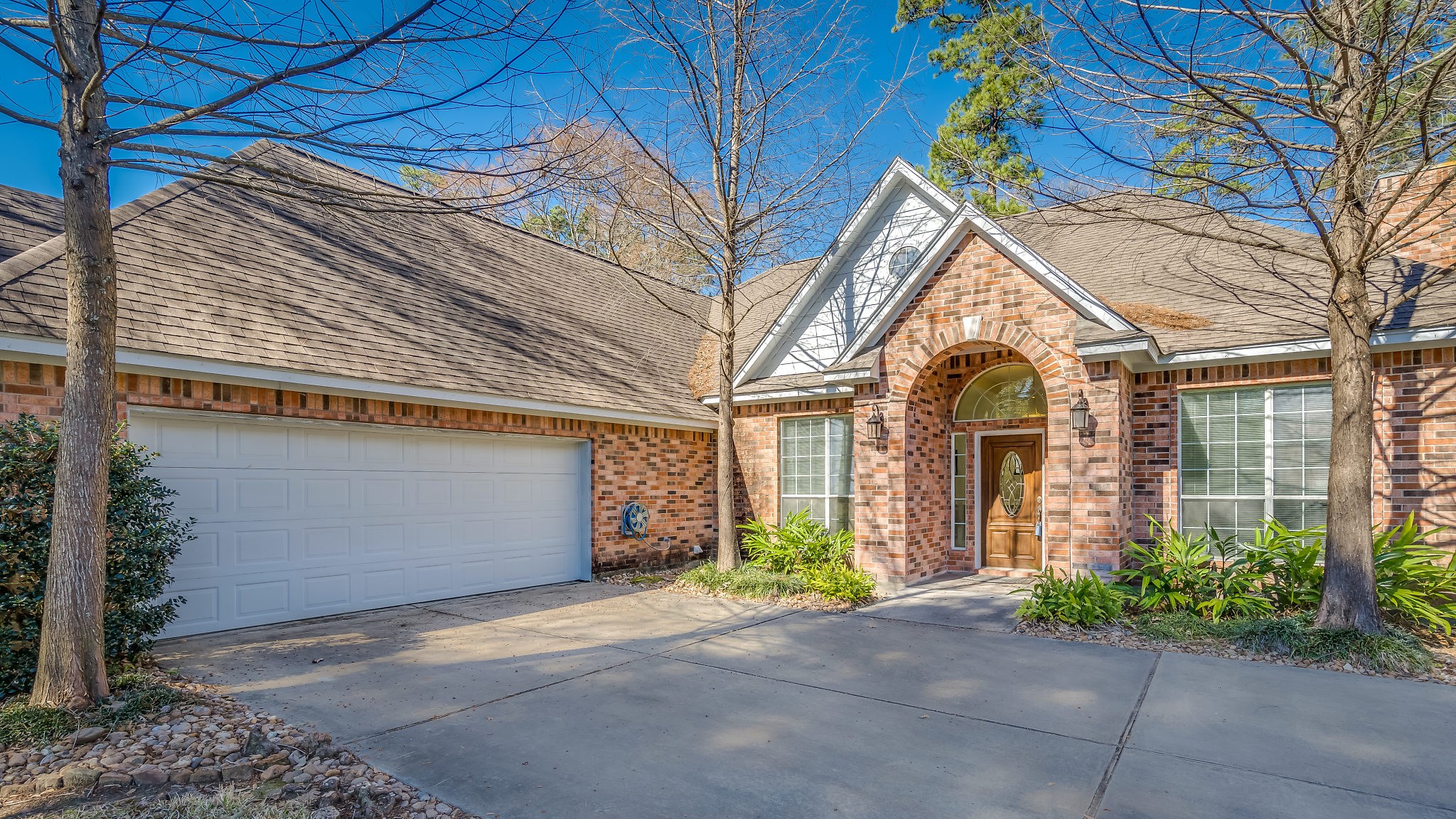 Home features a welcoming covered entry, an oversized sideload garage, and ample extra parking b