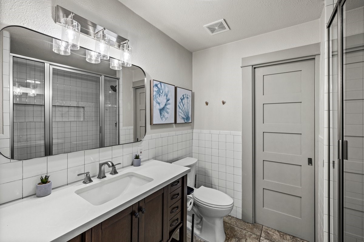 Primary Bathroom #1- Updated private bathroom with large shower w/ dual shower heads