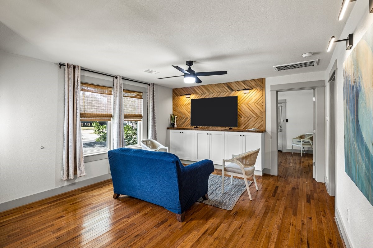 Beautiful real wood flooring adds warmth and timeless character to this remodeled Galveston home.